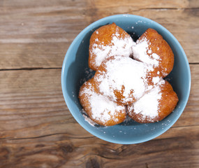 Traditional Dutch oliebollen on wooden background