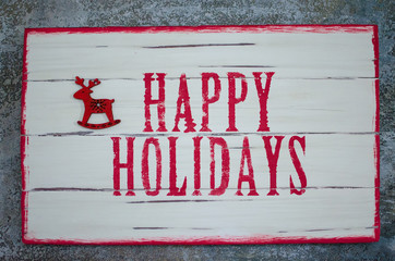 label Happy Holidays in red and white colors 