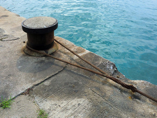 Industrial boat dock tie anchor point near water