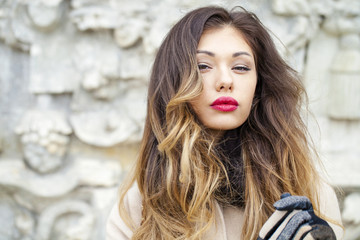 Naklejka premium Young beautiful woman in beige coat