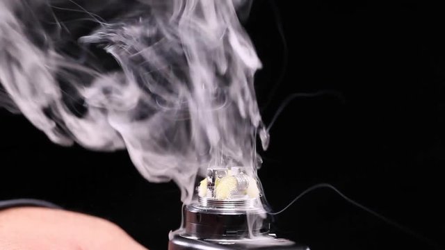 showing burn of juice or liquid in the coil, wire and cotton inside the atomizer of electronic cigarette for vaping, close up scene, high definition, Full HD, 1920x1080