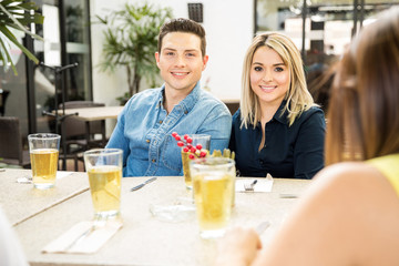Beautiful couple meeting with friends