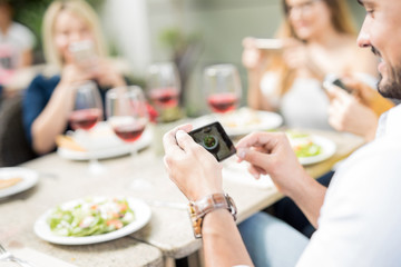 Man taking pictures of his food