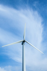 Wind turbines generating electricity on the blue skie