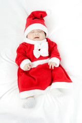 Portrait of adorable baby girl with santa costume. Isolated on w
