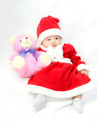 Portrait of adorable baby girl with santa costume. Isolated on w