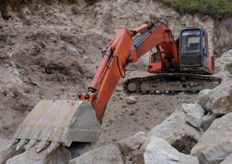 Excavator in stones