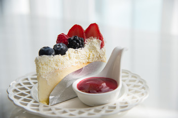 Cheese cake topped with mix berries and strawberry flavour 