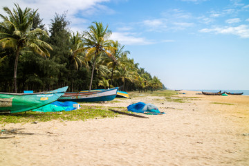 Abandonned artistic wooden canoe on a lonely beach