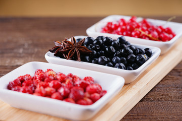 Berry fruits in a dishes 