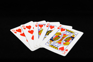 playing cards for the poker on a black background