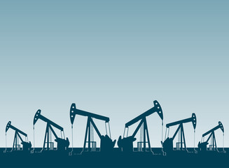 silhouette of working oil pumps , oil industry equipment