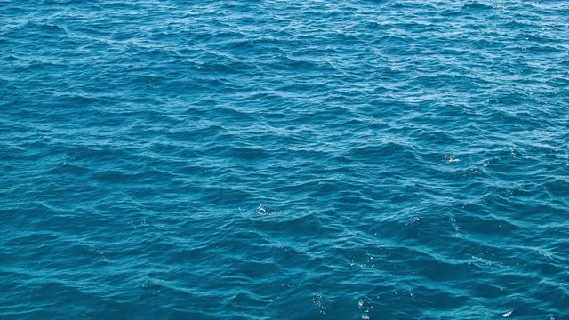 Detailed Blue Sea Water Closeup with Smooth Movement During Good Weather
