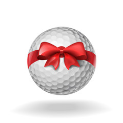 Golf ball tied with a red bow on white
