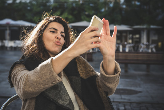 40 Year Old Woman Taking Selfie