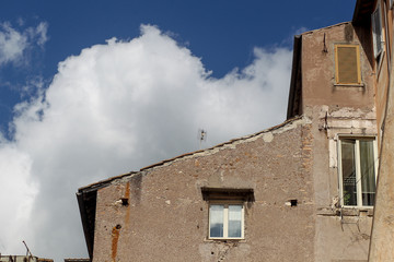 Building facade with windows, on blue sky, Rome, Italy