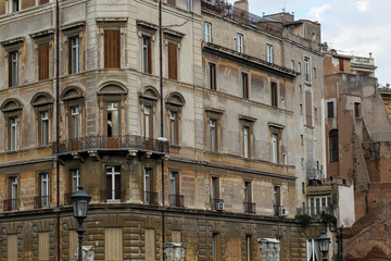 Fototapeta na wymiar Building facade with windows, on blue sky, Rome, Italy