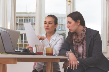 Group of young people discussing business plans.