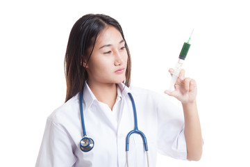 Young Asian female doctor look at syringe.