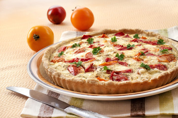 Tart with salted sheep cheese and tomatoes