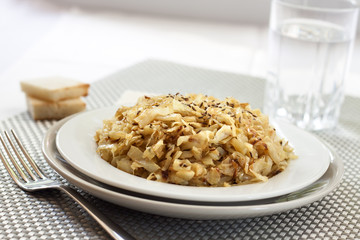 Fried cabbage with caraway and garlic on a plate