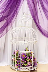 Beautiful decorative cage with  flowers