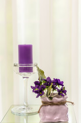 Obraz na płótnie Canvas Interior details of a purple tone colors and candle