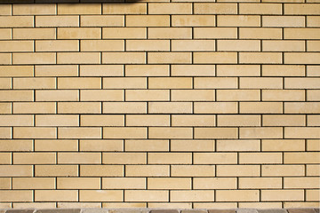Obraz premium High resolution texture of a yellow brick wall. Laying horizonta