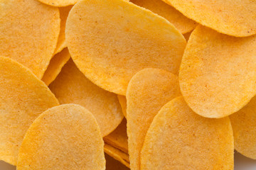 Close up potato chips on wood top view background.