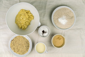 Overhead view of bowls of different healthy baking ingredients
