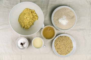 Overhead view of bowls of different healthy baking ingredients