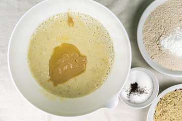 Overhead view of full bowls of different baking ingredients and mixtures