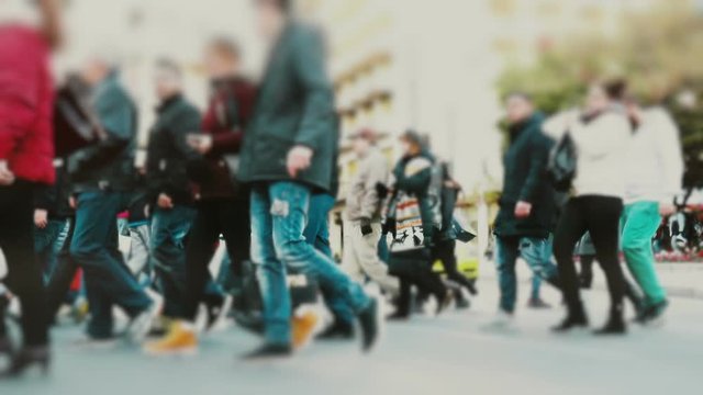 Big city crowd, anonymous people cross a busy street intersection.100fps gimbal stabilized dolly shot of an anonymous crowd of pedestrians crossing a busy city intersection.No logos or faces visible.