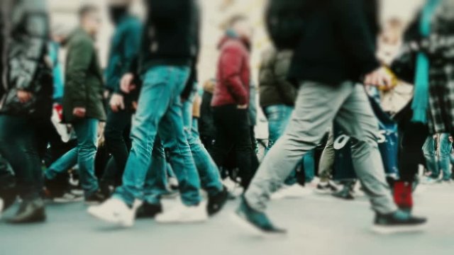Big city crowd, anonymous people cross a busy street intersection.100fps gimbal stabilized dolly shot of an anonymous crowd of pedestrians crossing a busy city intersection.No logos or faces visible.