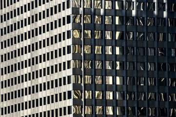 high rise office building exterior with reflections in window office