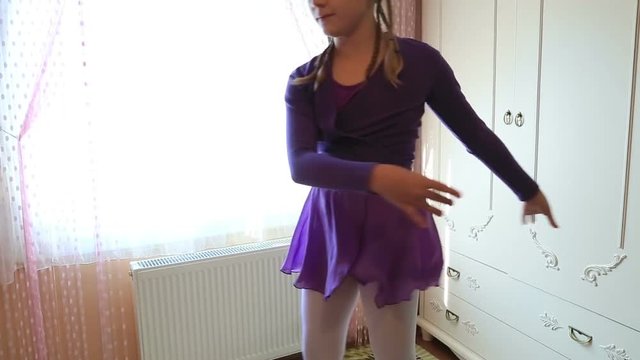Graceful girl practicing ballet