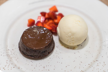 Chocolate lava cake with ice cream .