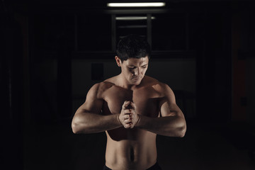 Fototapeta na wymiar Brutal bodybuilder athletic man perfect abs, shoulders, biceps, triceps and chest.