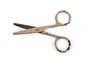 old scissors on a white background