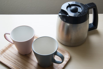pair of mug and coffee pot