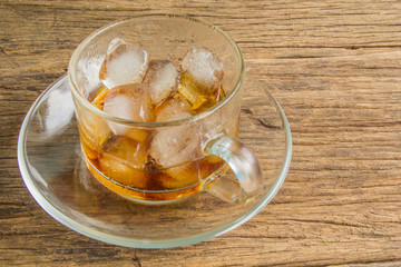 Ice coffee on wooden background