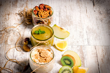 Healthy eating, healthy food - oat meal, green smoothie and nuts