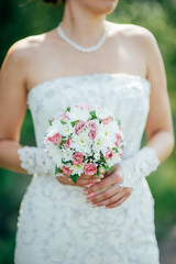 bridal bouquet in hands of the bride