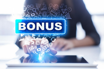 Woman is using tablet pc, pressing on virtual screen and selecting bonus.