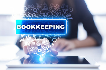 Woman is using tablet pc, pressing on virtual screen and selecting bookkeeping.