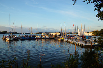 Fototapeta na wymiar Lake boat trips in summer sunset