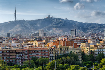 Barcelona cityscape and Monserrat mountain in sunset light, Spain