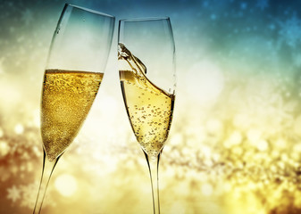 toasting with champagne glasses against holiday lights