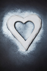 Holidays gift and heart on a black background. Valentines day