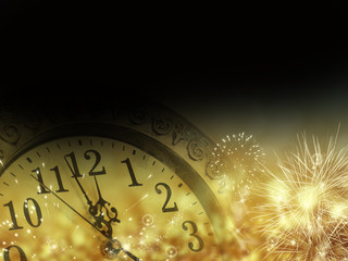 Obraz na płótnie Canvas old clock with fireworks and holiday lights